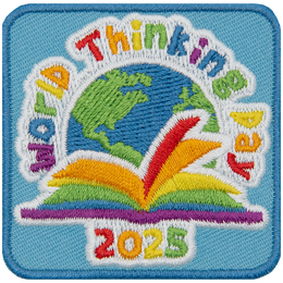 A rainbow book sitting in front of a globe under the words World Thinking Day.