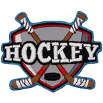 Two hockey sticks are crossed behind the word Hockey.