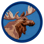 The bust of a moose is on a blue, circular badge.