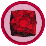 A red garnet is in the centre of a circular pink badge.