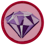 A shiny amethyst on a pink background.