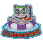 A hippo in a purple and white striped life preserver above the word Swimming.