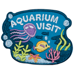 A jellyfish and a fish swim under the words Aquarium Visit.