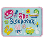 A bunch of spa supplies surrounding the words Spa Sleepover.