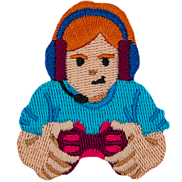 A red-haired person holding a controller, wearing a headset.