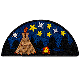 A tipi under the stars next to a campfire.
