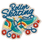 Two cyan roller skates with an orange and yellow rainbow on the heels.
