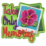 A polaroid photo of a wild rose sits next to the words Take Only Memories.