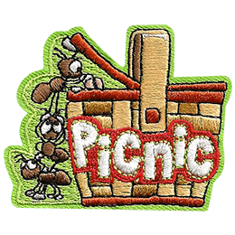 Three ants stand on each other to reach inside a picnic basket. 