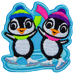 Two penguins skate on a swirl of ice. Both penguins wear winter hats and scarves.