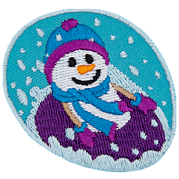 A smiling snowperson in mitts and a toque tubes down a hill in a purple tube.