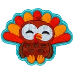An adorable turkey faces the viewer.