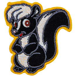 This adorable skunk is sitting on its hind legs with its forelegs tucked against its belly.