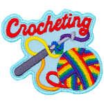 A ball of rainbow yarn is twisted around a crochet hook. The word Crocheting is across the top.