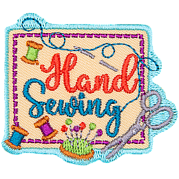 A square piece of fabric with three spools of thread, scissors, a sewing needle and the words Hand Sewing on top of it.