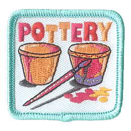 Two cups being painted with pink paint under the word Pottery.