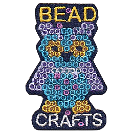 A blue owl made out of Perler beads under the words bead crafts.