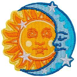 The sun peeks out from behind a crescent moon.