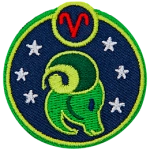 This circular crest has the side profile of a ram surrounded by stars. The sign of Aries sits above his head.