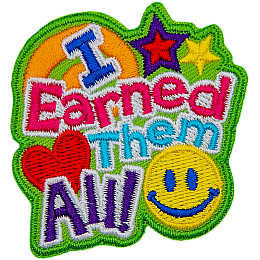 The words I Earned Them All dominate this patch. In the bottom right sits a yellow smiley face, and in the top right are two stars.