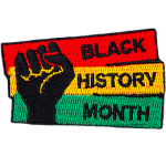 A fist pumps the air in solidarity with Black History Month.