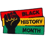 A fist pumps the air in solidarity with Black History Month.
