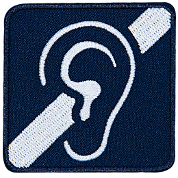 An ear on a blue background with a crossed-out speaker.