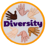 This circular crest displays hands of different skin colour to represent diversity.