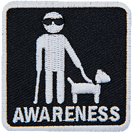 A white stick figure wearing sunglasses and holding a walking stick and the leash of a guide dog. The word Awareness is below.