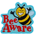A smiling bumble bee hovers over the words Bee Aware.