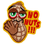 A peanut holds out its hand in a stop gesture. The text on the right side of the patch reads, No Nuts!!!