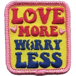 The words Love More Worry Less on a yellow background.