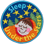 A child is tucked tight in a sleeping bag as they nap under a starry sky.