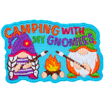 Two gnomes are out camping and roasting marshmallows over a roaring campfire.