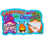 Two gnomes are out camping and roasting marshmallows over a roaring campfire.