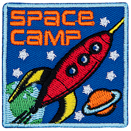 A red rocket blasts through space past Earth and Saturn. The words Space Camp are in the top left corner.