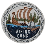 A Viking ship is on the water above the words Viking Camp.