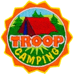 This round crest displays the text Troop Camping with a tent set up in a grassy field.