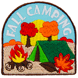 Autumn leaves fall on a tent and campfire, symbolizing fall camping.