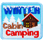 The words Winter Cabin Camping surround a red-roofed cabin in a snowy landscape. 