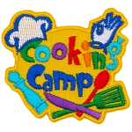 The words Cooking Camp are surrounded by cooking utensils and a chef's hat.