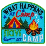 The words What Happens At Camp Stays At Camp are around a red tent and campfire.