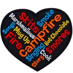 A wordle in the shape of a heart. It has campfire-related words, such as smoke, songs and cook.