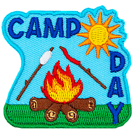 A marshmallow and hotdog roast over a fire. The words Camp Day are above and on the right.