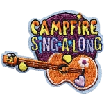 A guitar with flower stickers is beneath the words Campfire Sing A Long.