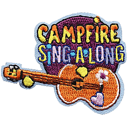 A guitar with flower stickers is beneath the words Campfire Sing A Long.