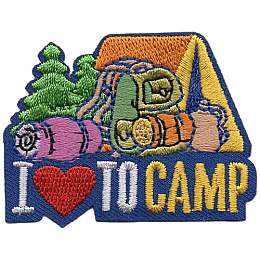 A tent, sleeping bag and backpack sit on top of the words I Love To Camp.