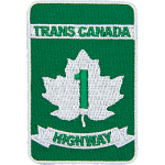 This patch resembles a road sign. A white maple leaf sits in between the words Trans Canada Highway. The number 1 is inside the leaf.