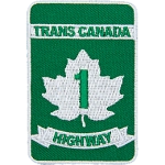 This patch resembles a road sign. A white maple leaf sits in between the words Trans Canada Highway. The number 1 is inside the leaf.