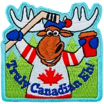 An anthropomorphic moose in a maple leaf jersey holds a hockey stick and coffee cup. The words Truly Canadian Eh! are across the bottom.
